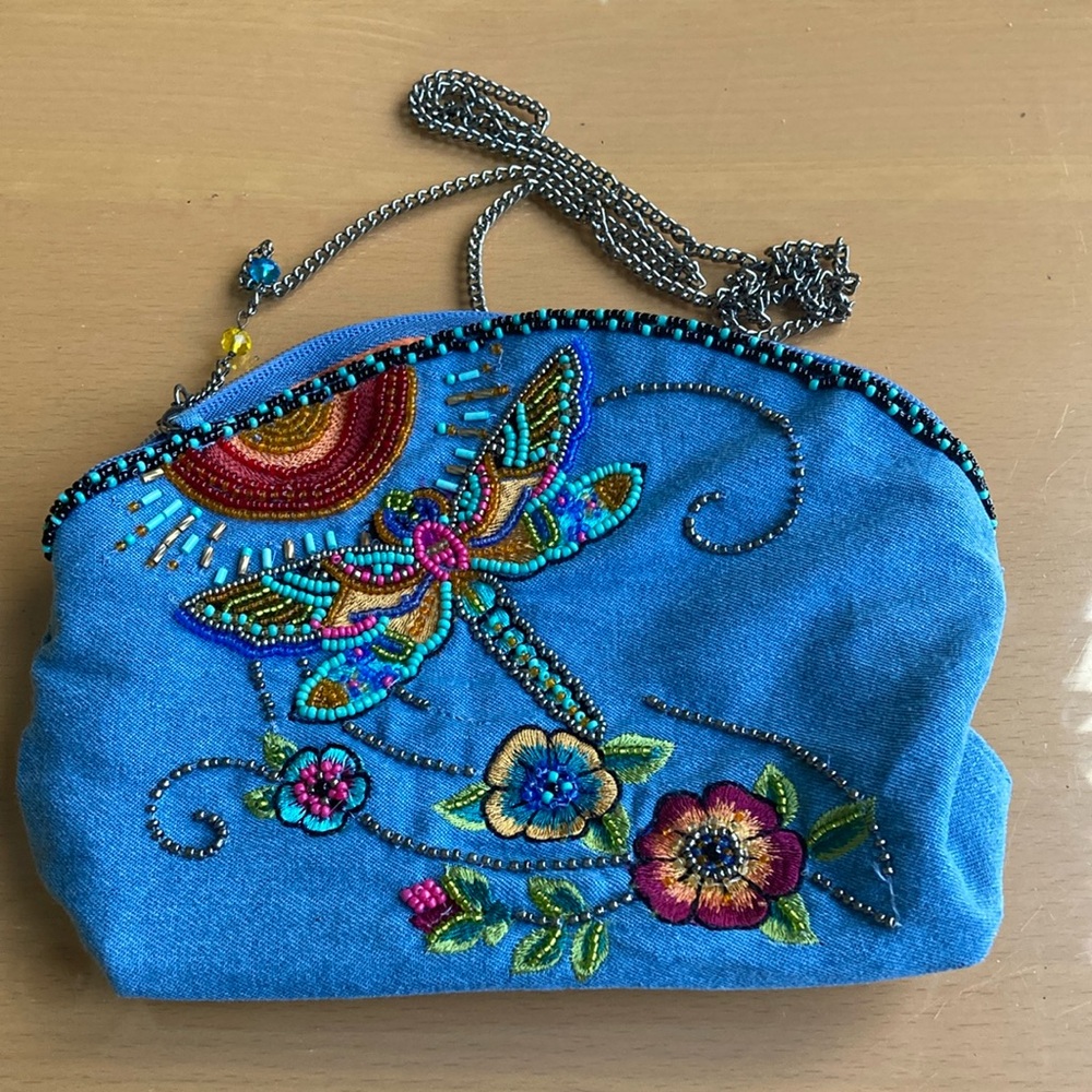 Mary Frances Blue Embroidered with long chain.